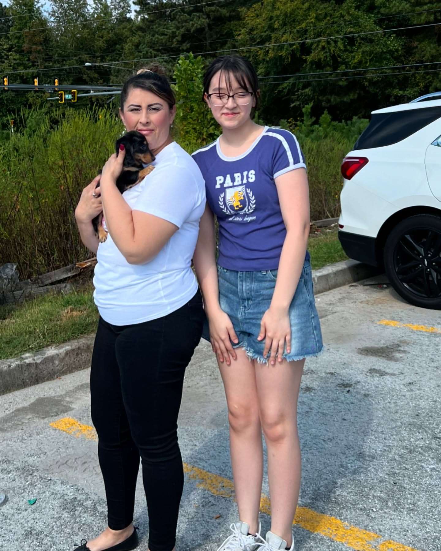 Happy family with their Dachshund puppy