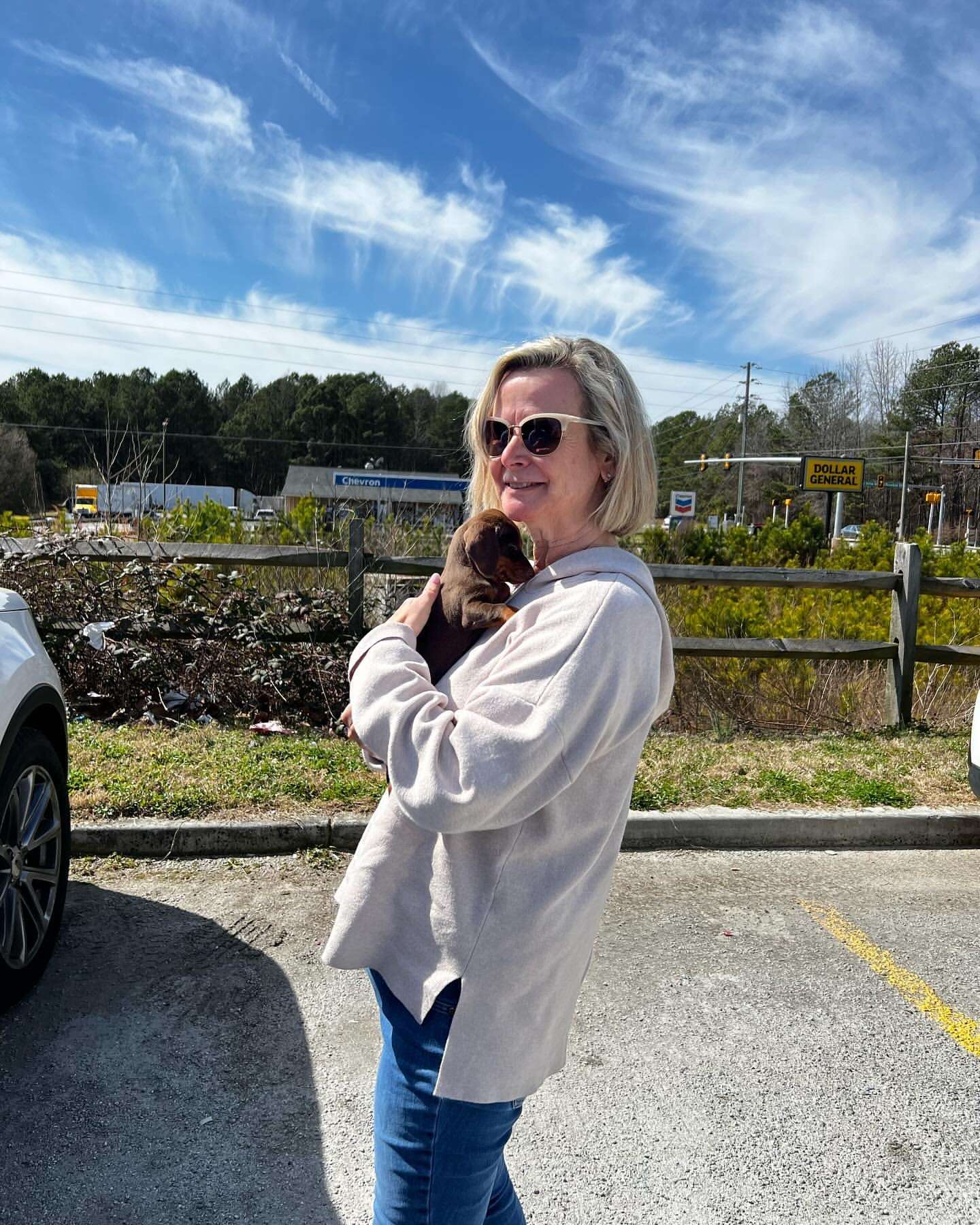 Happy family with their Dachshund puppy
