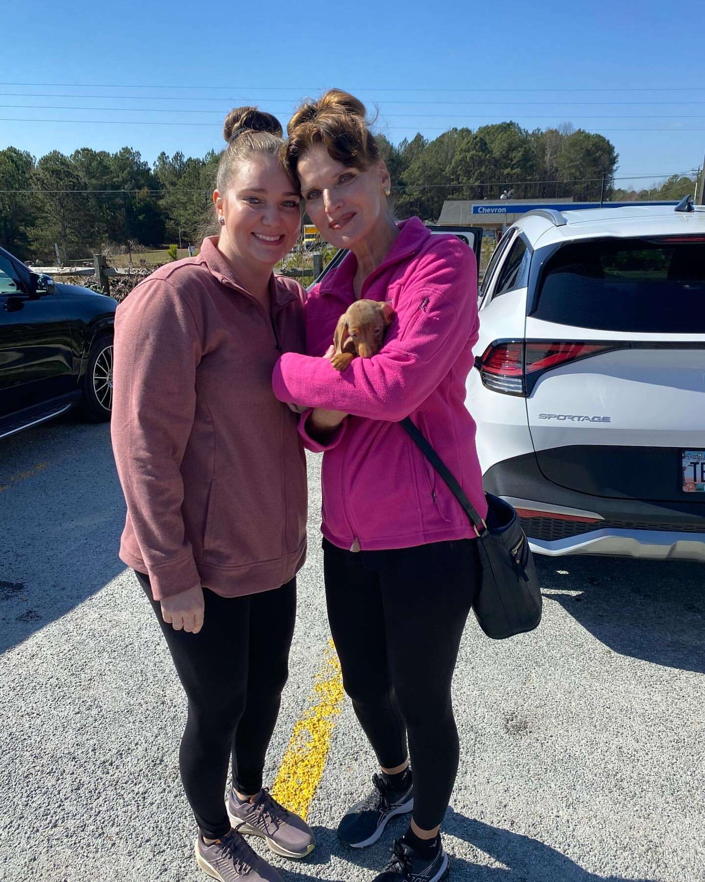 Happy family with their Dachshund puppy