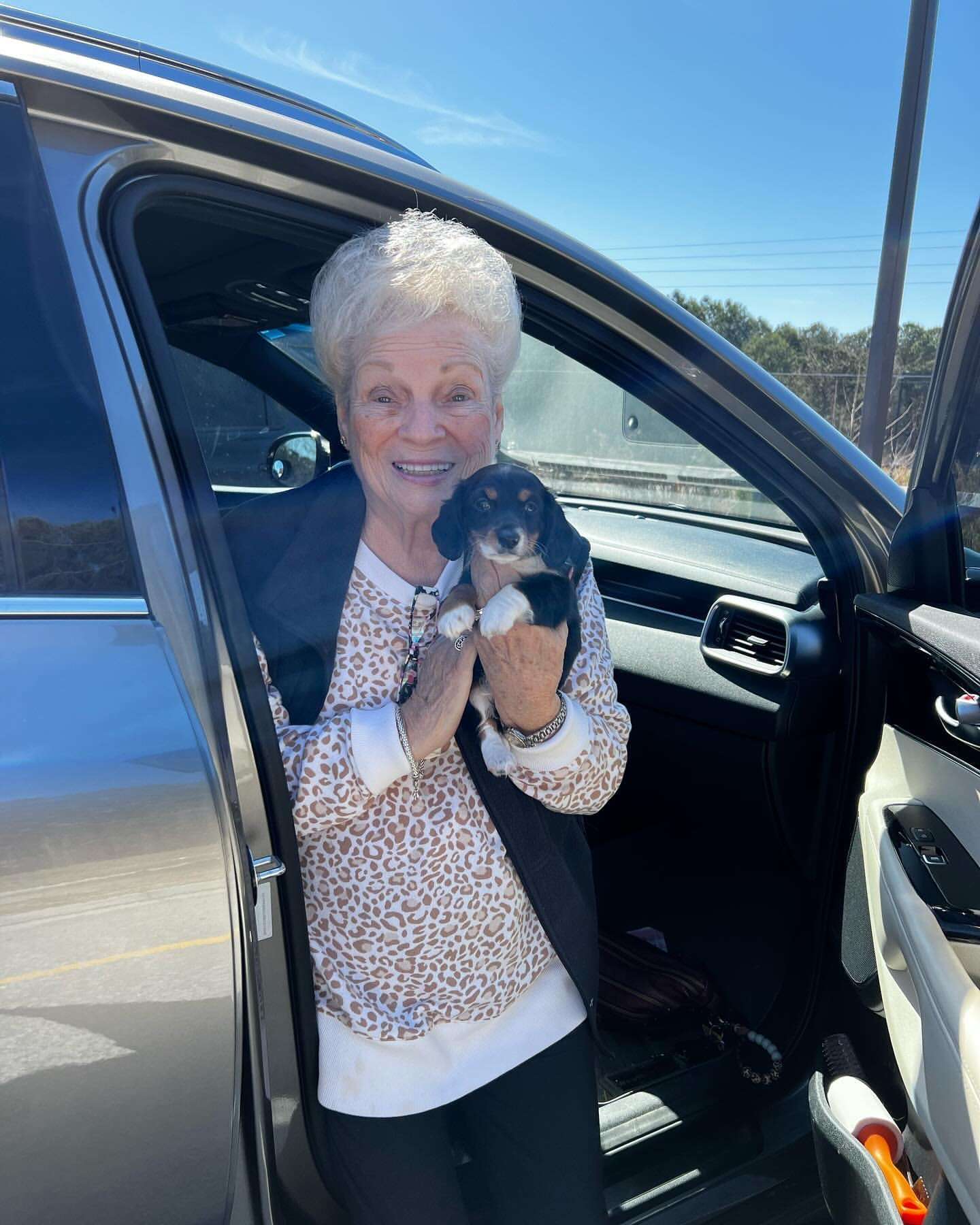 Happy family with their Dachshund puppy