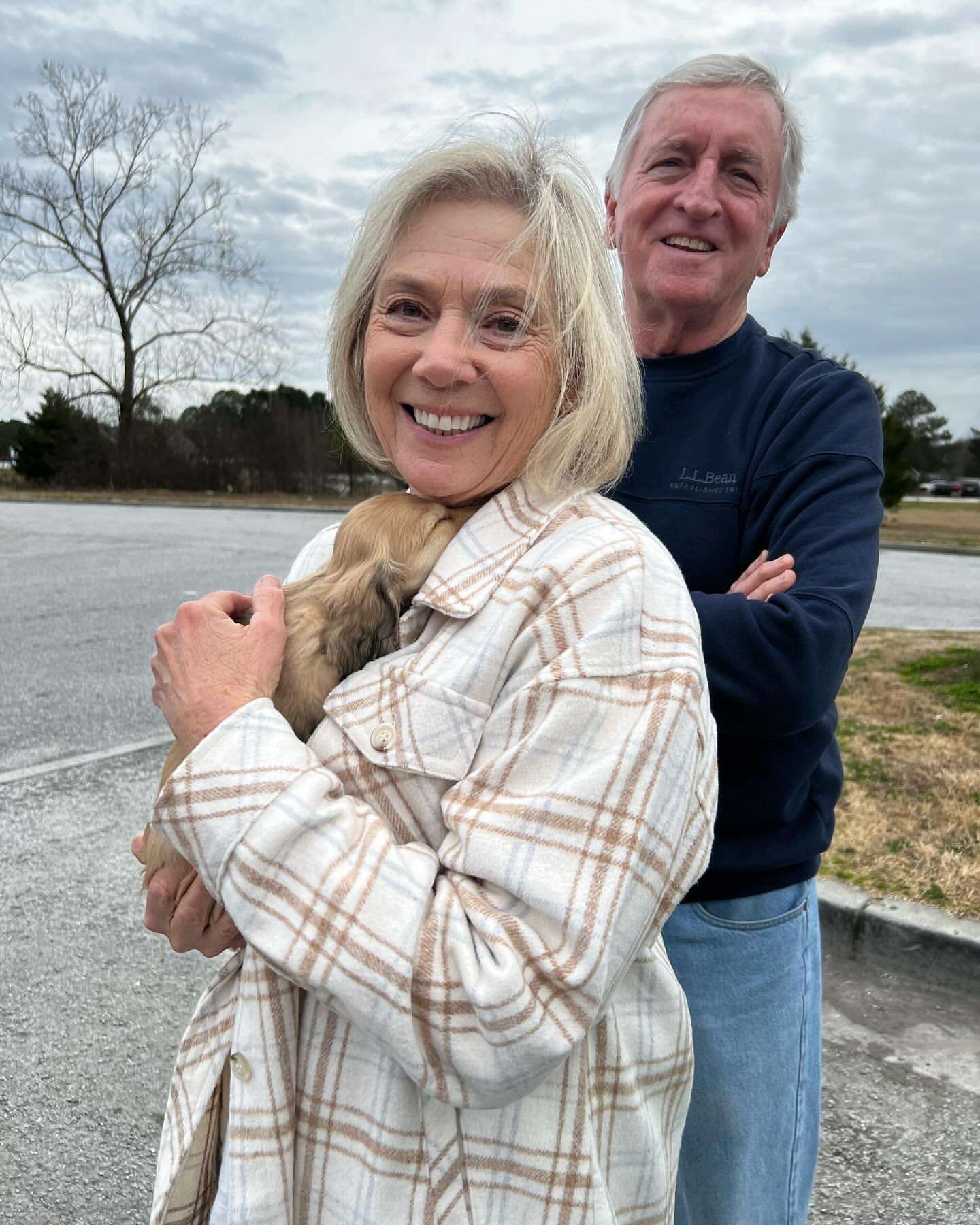 Happy family with their Dachshund puppy