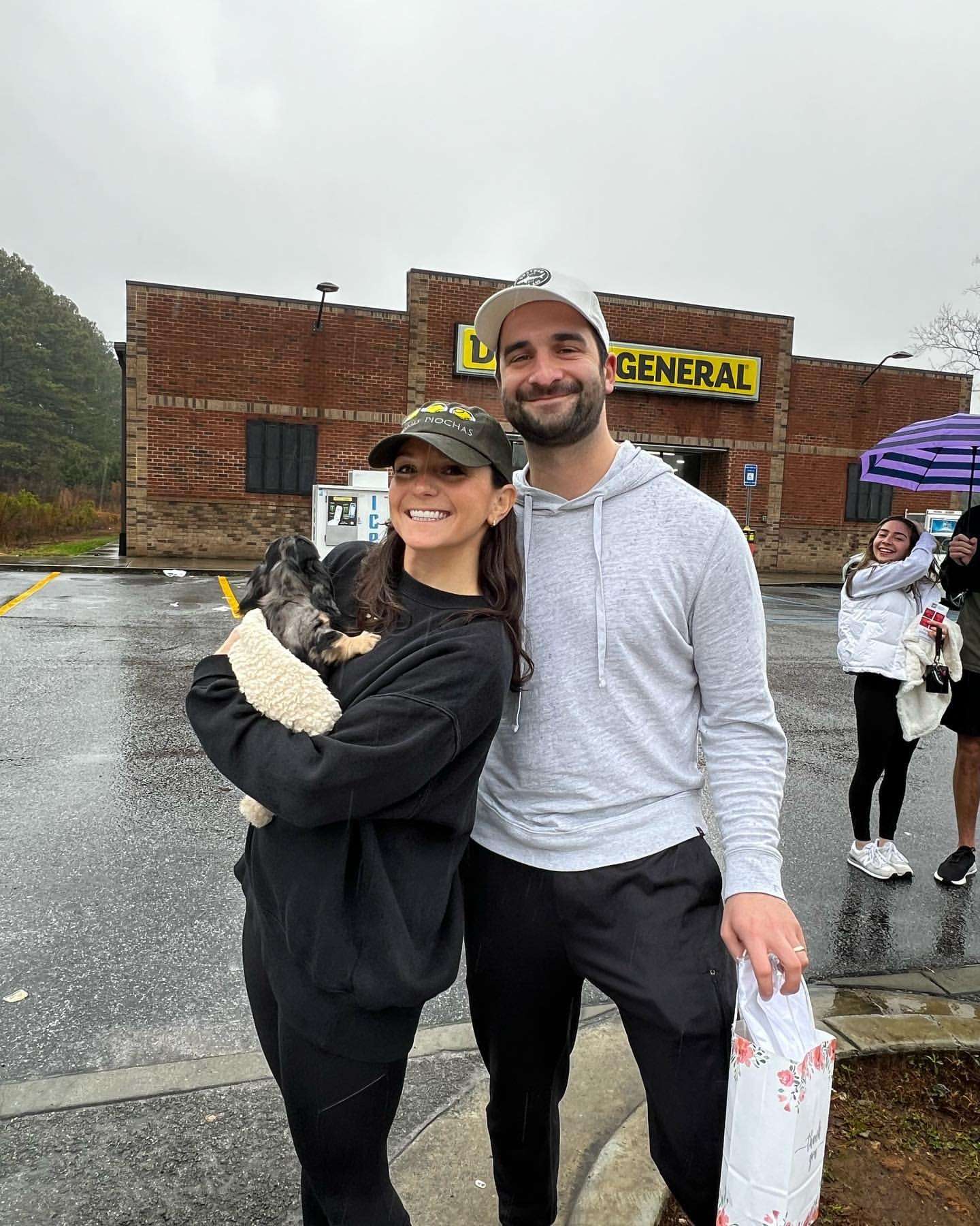 Happy family with their Dachshund puppy