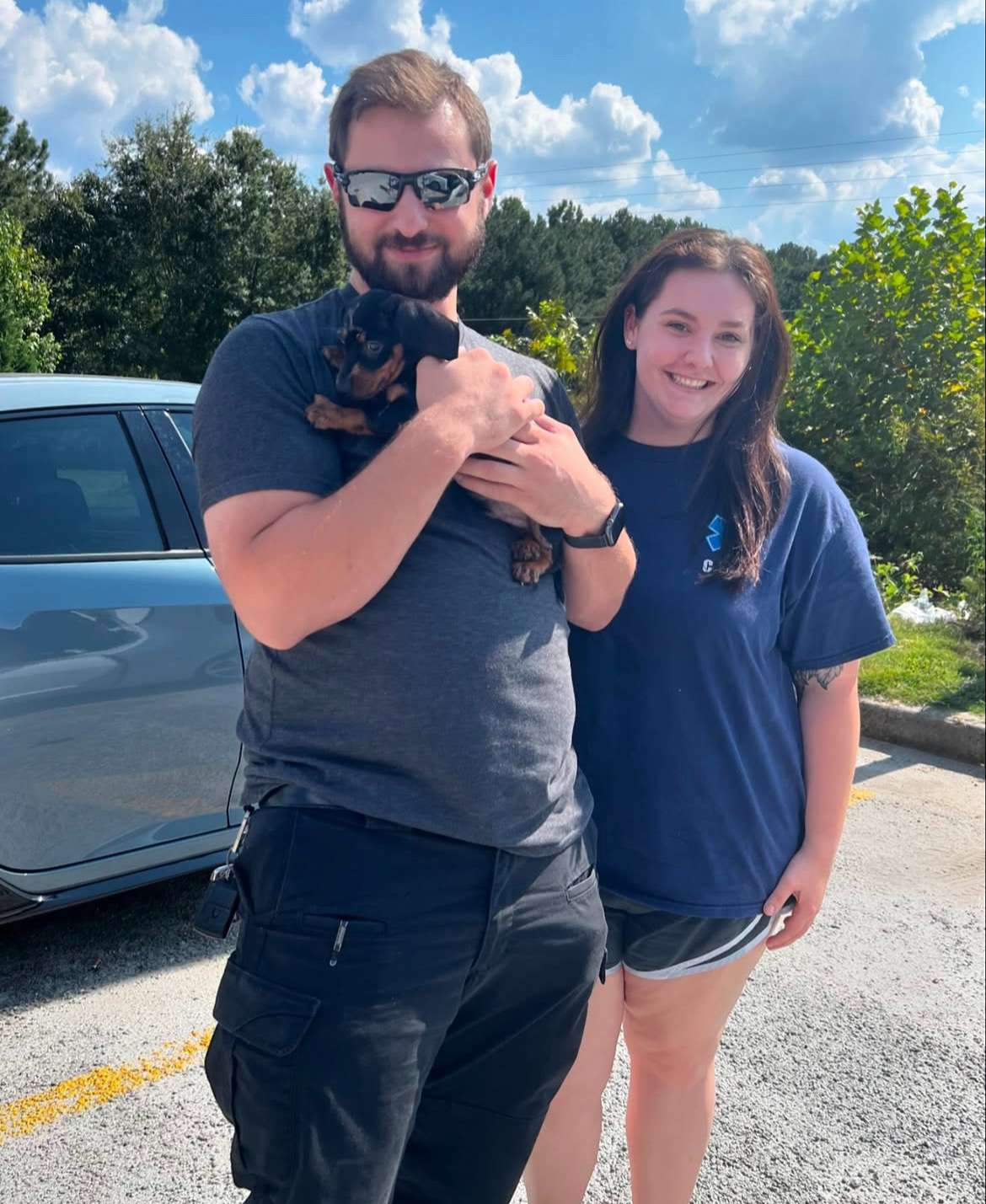 Happy family with their Dachshund puppy